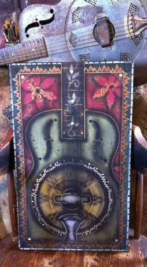 funky national guitar painting. Mixed media on pine.